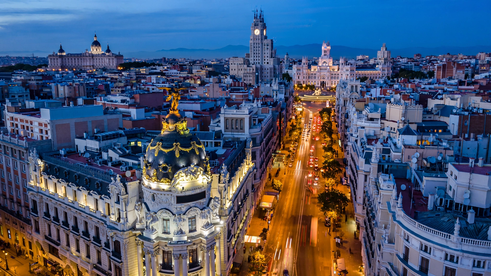 Madrid skyline over Gran Vía and the Metropolis Building at blue hour