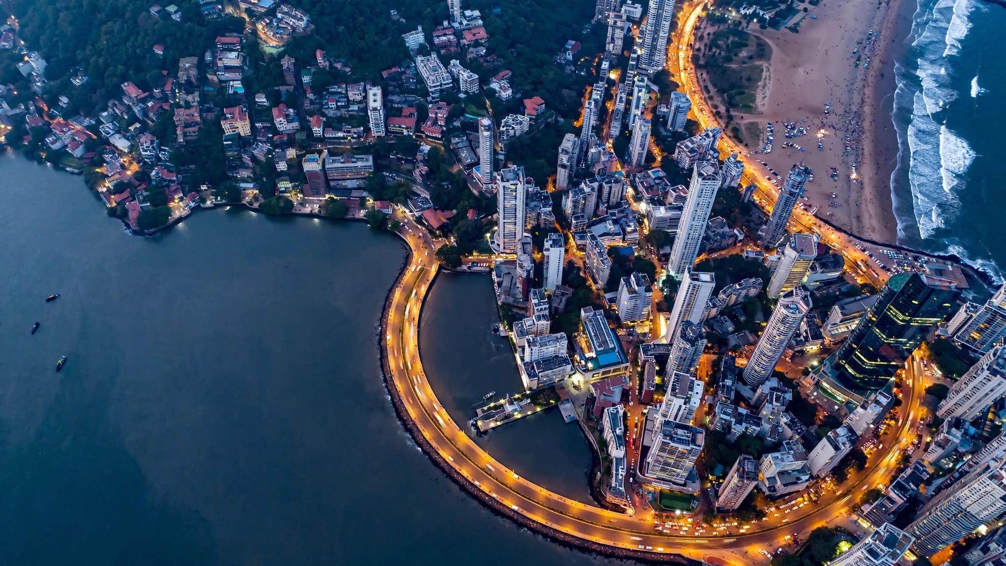 Mumbai skyline over Marine Drive and high-rises along the coast at blue hour