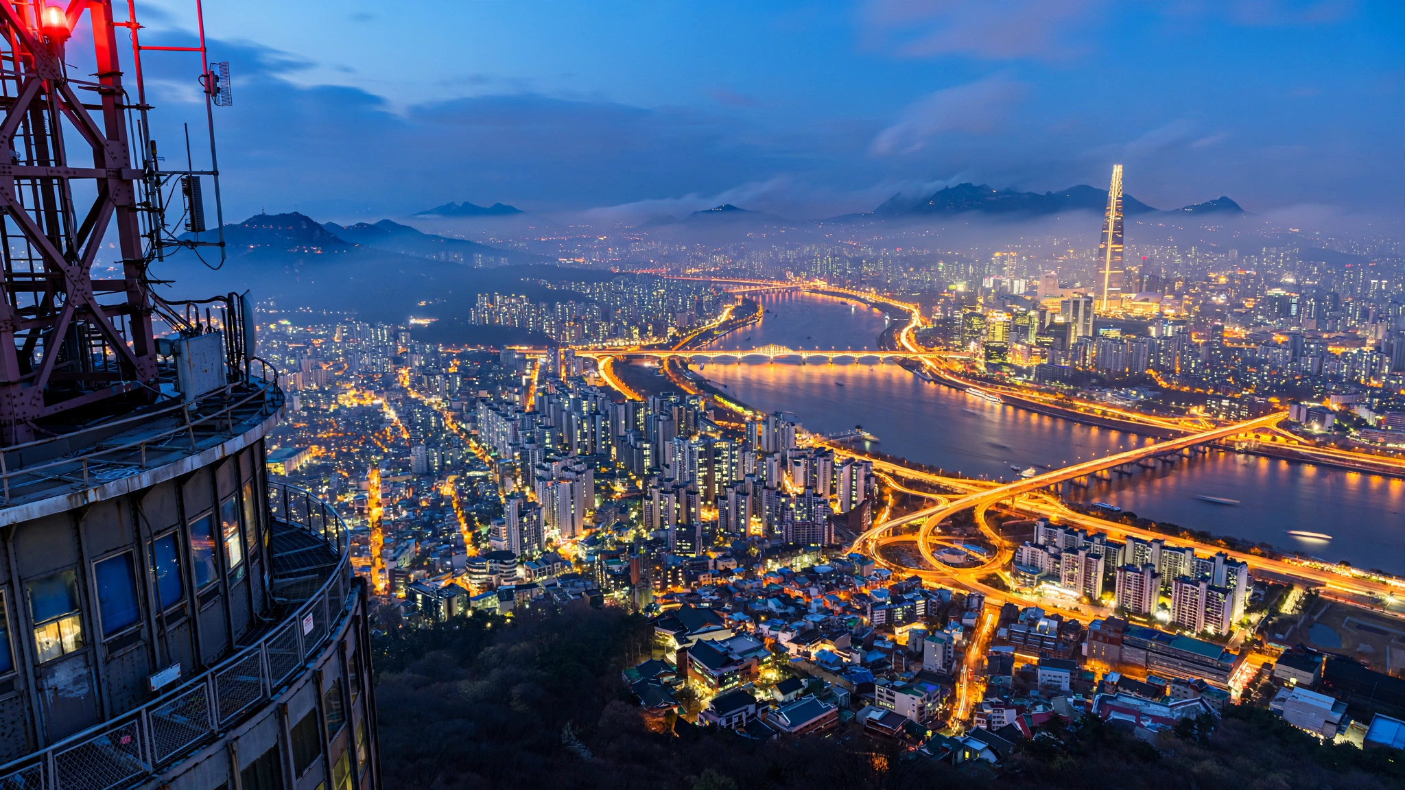 Seoul skyline over the Han River and Lotte World Tower at dusk