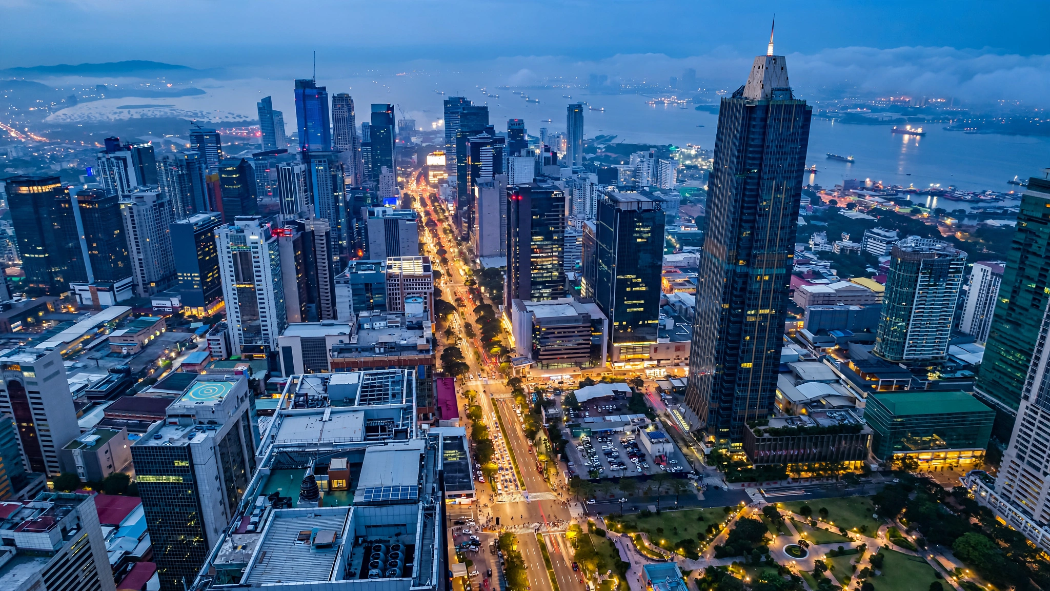 Manila skyline over Makati and high-rises at blue hour